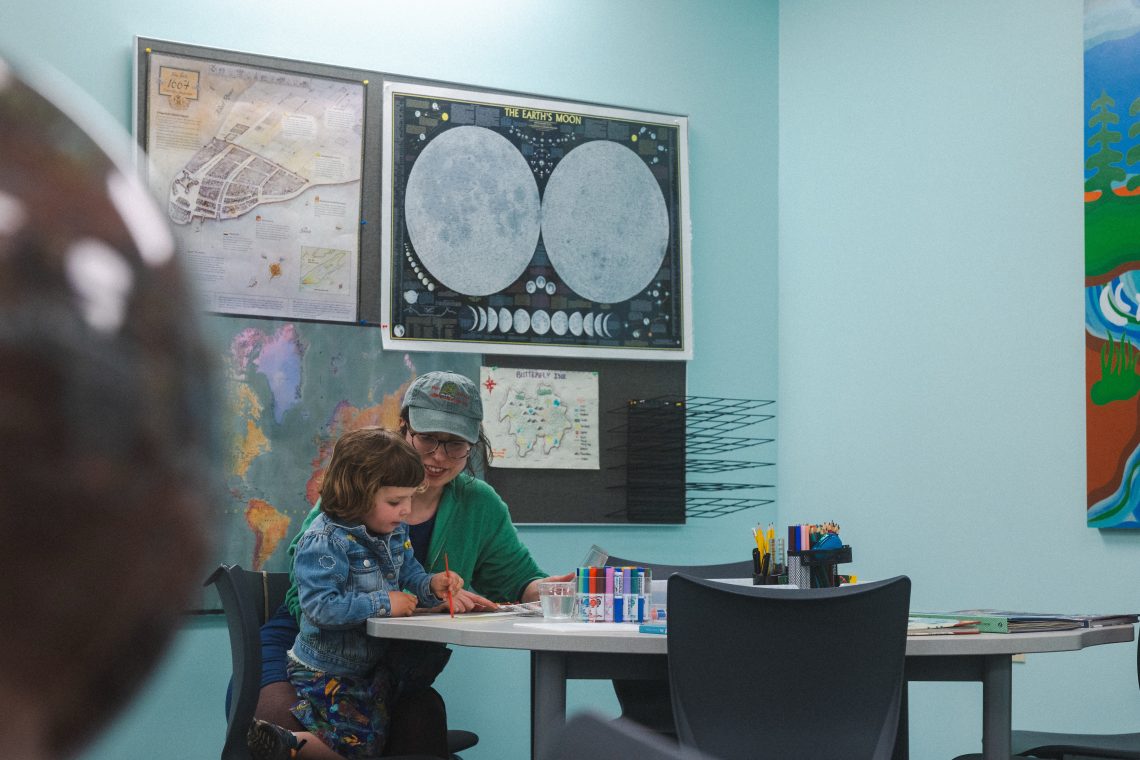 Community members participating in activities at the Map Lab open house.
