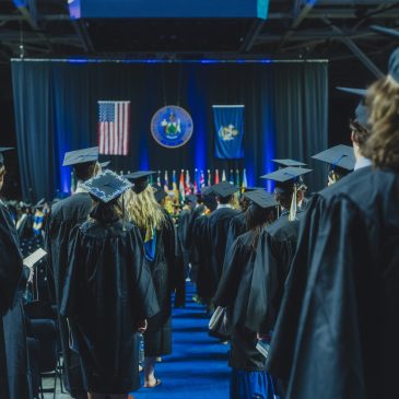 Students lining up to receive diplomas at USM's 2025 Commencement Ceremony.