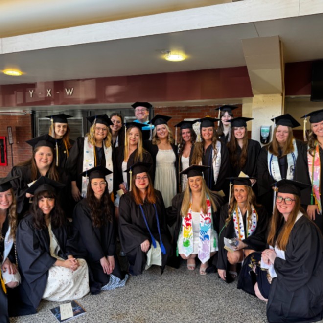 Students in their cap and gown at their graduation