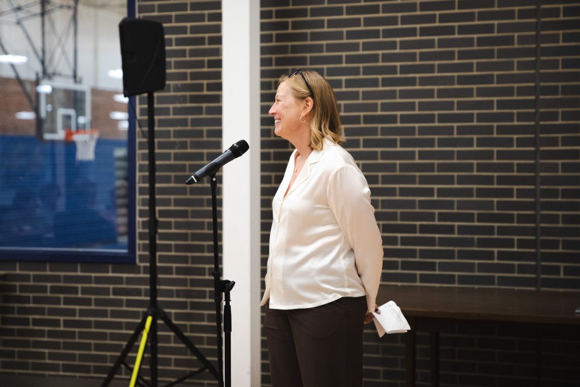Kathy Garrard, president of the Gorham Village Alliance, smiles while speaking at the "Good People, Great Connections" networking event at USM.