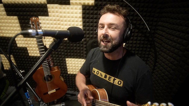 A still of a man playing from WMPG documentary "An Extraordinary Place".