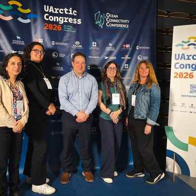 Five members of the USM delegation pose in front of the UArctic Congress 2026 and Ocean Connectivity Conference backdrop in Tórshavn, Faroe Islands.