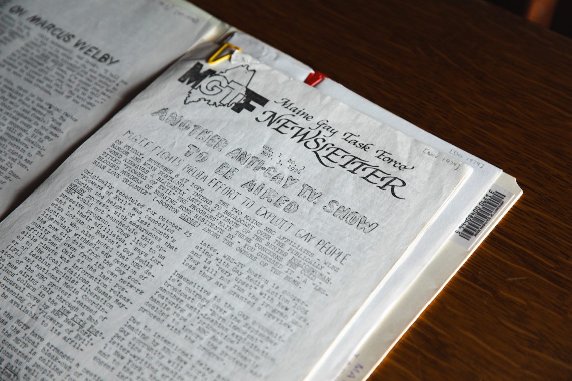 A 1974 issue of the Maine Gay Task Force Newsletter, open to a page headlined 'Another Anti-Gay TV Show to Be Aired,' describing the group's effort to challenge a broadcast deemed offensive to gay people.