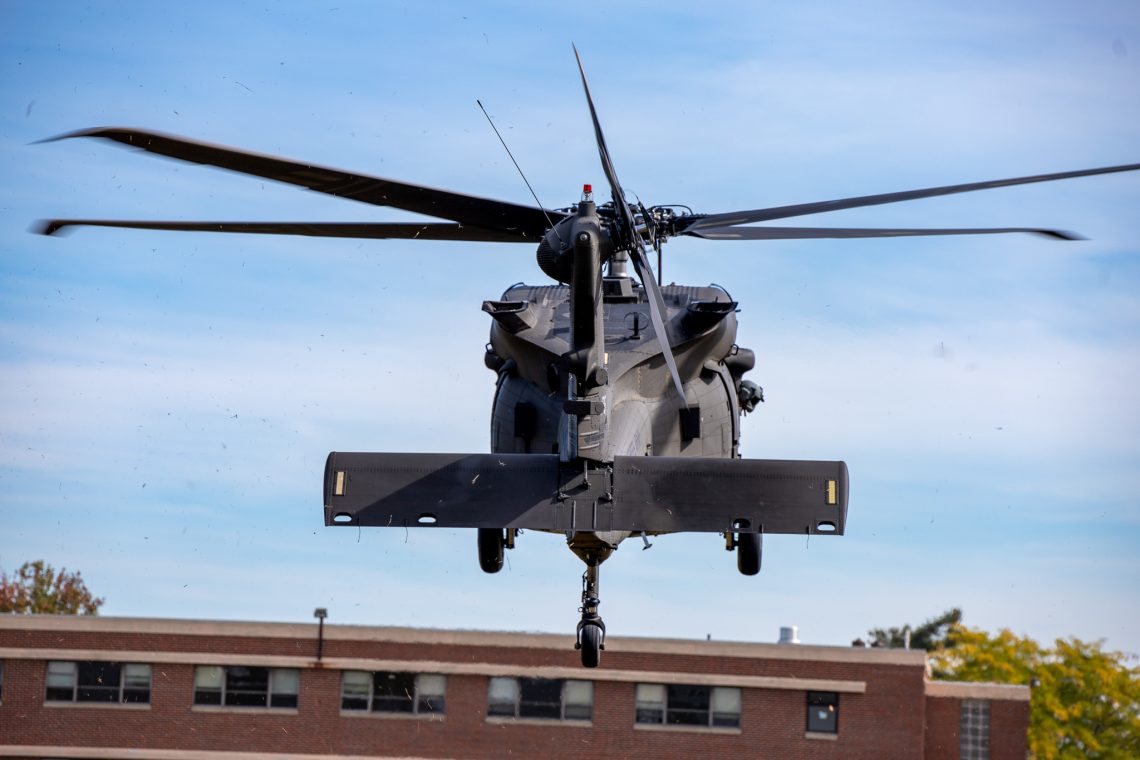UH-60 Black Hawk helicopter landing on Paula Hodgdon Field on Gorham campus.