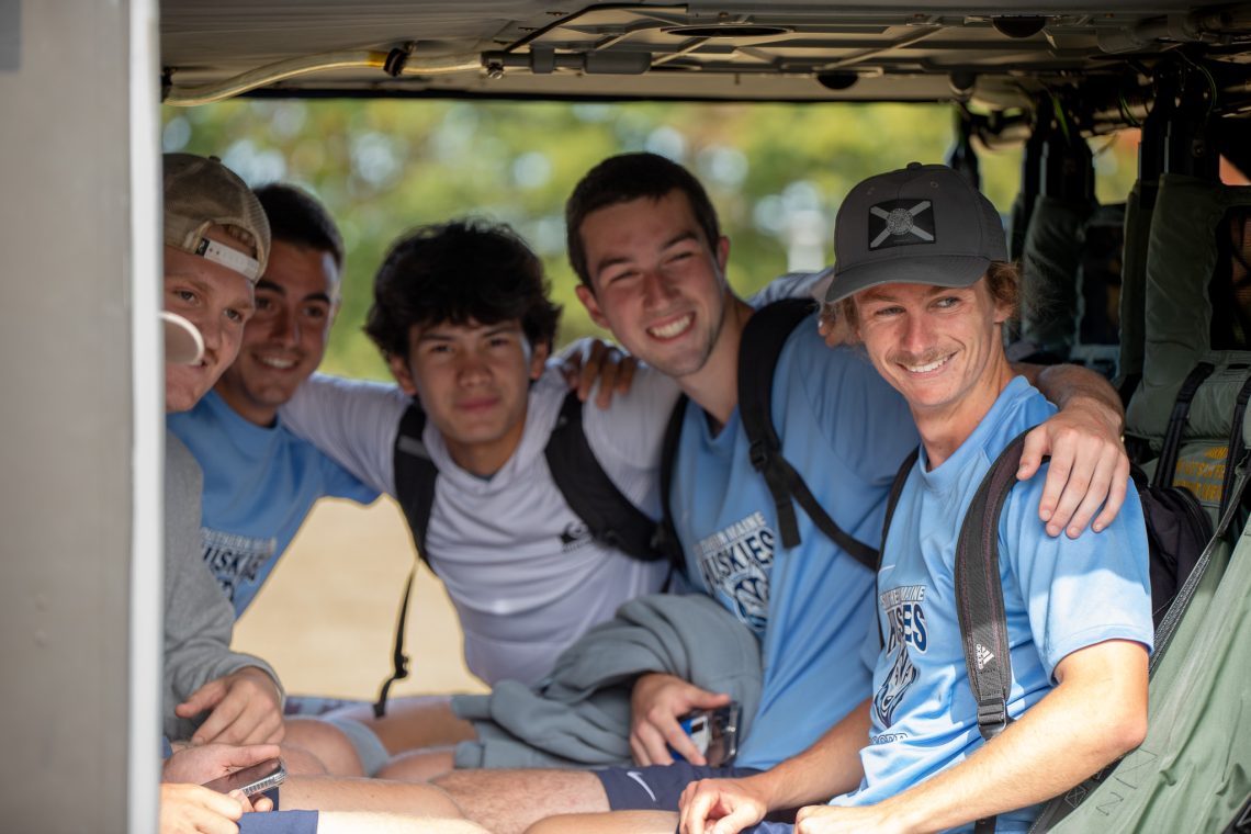 USM students sitting in the cabin of the UH-60 Black Hawk.