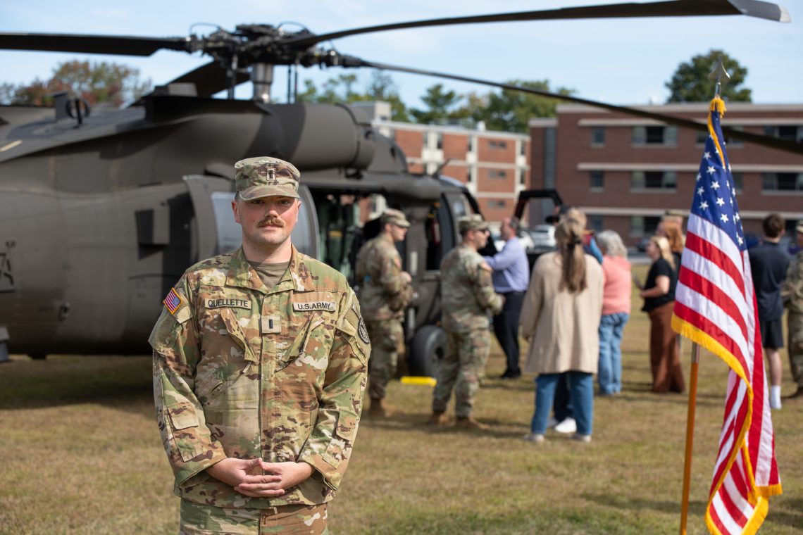 1st Lt. Donald "Don" Ouellette '24 stands in front of a UH-60 Black Hawk helicopter.