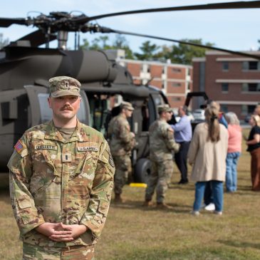 1st Lt. Donald "Don" Ouellette '24 stands in front of a UH-60 Black Hawk helicopter.
