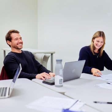 Two students sitting in a classroom