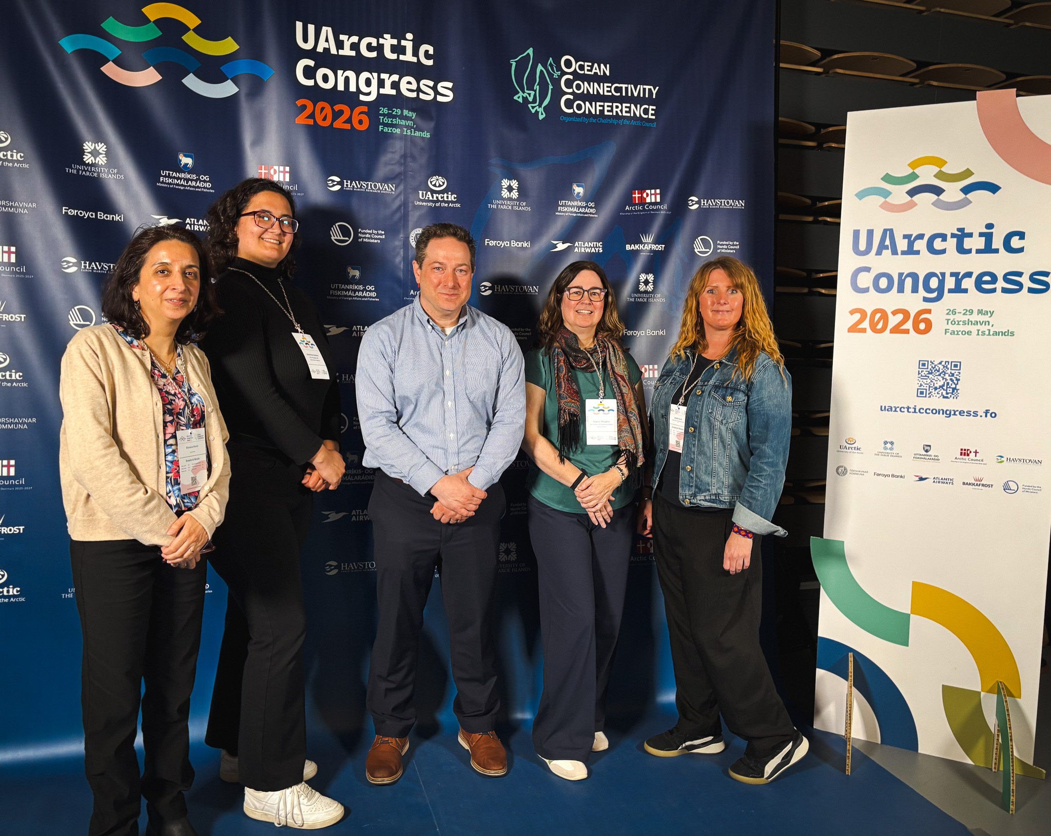 Five members of the USM delegation pose in front of the UArctic Congress 2026 and Ocean Connectivity Conference backdrop in Tórshavn, Faroe Islands.