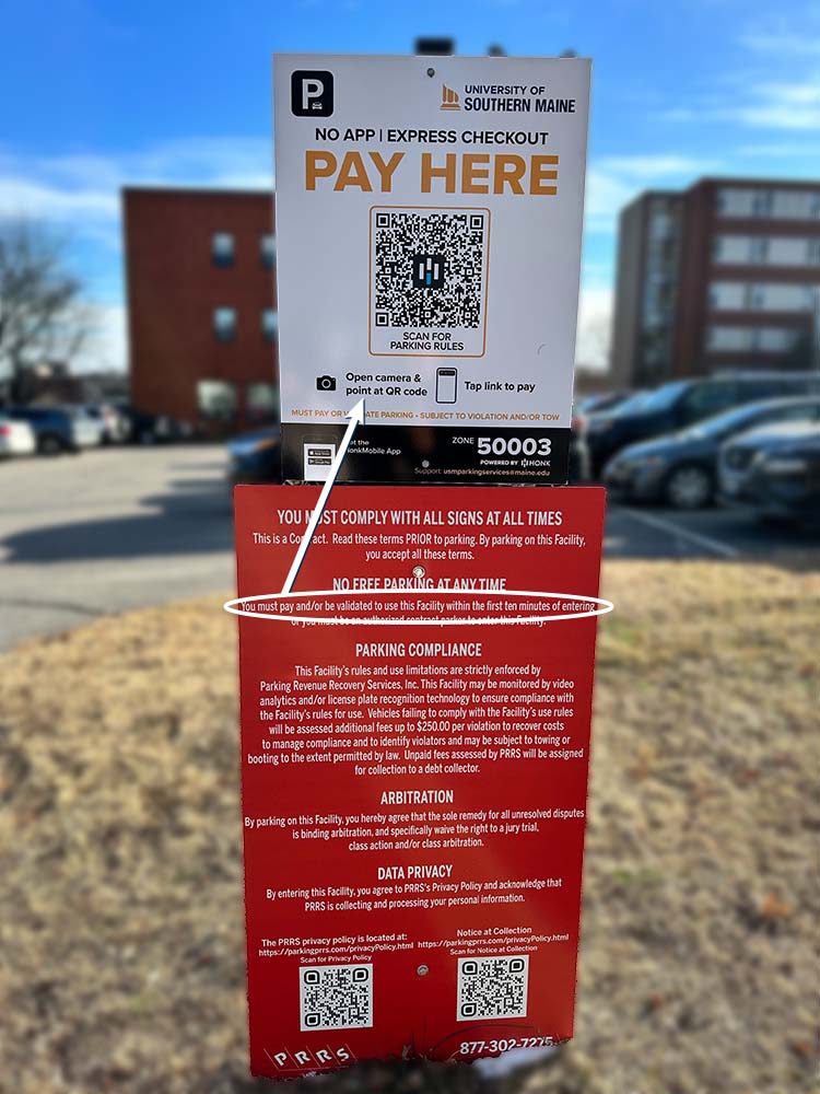 A PAY HERE parking sign on our Gorham campus.