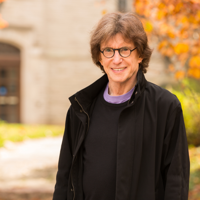 Headshot photo of Henry Giroux, USM 2026 Commencement Speaker, smiling with fall leaves in the background.