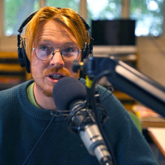 A midday radio host on WMPG talks to listeners between songs.