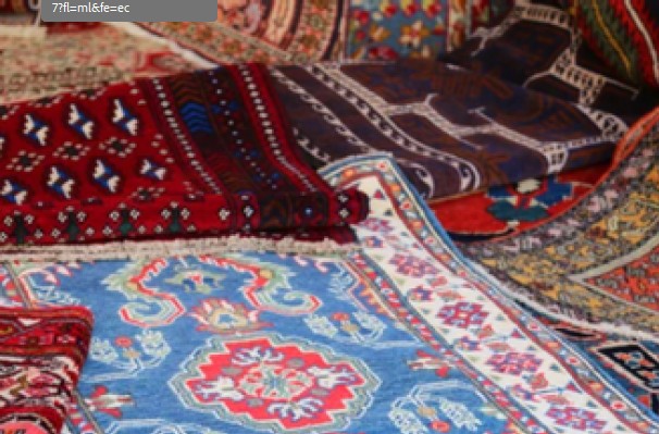 Woven rugs spread out on top of each other