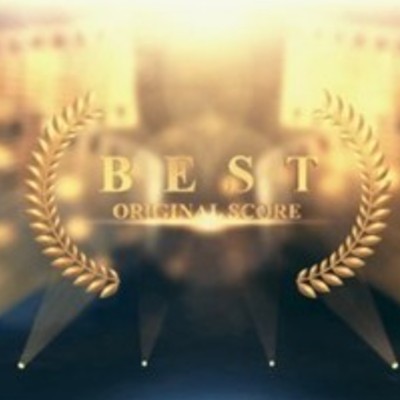 Golden laurel wreath surrounding the words "BEST ORIGINAL SCORE" with a blurred background of spotlights and stage lights.
