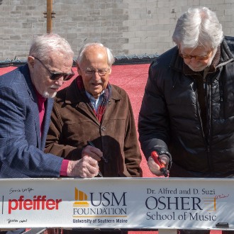 Supporters of the new Crewe Center for the Arts sign the project's last structural beam.