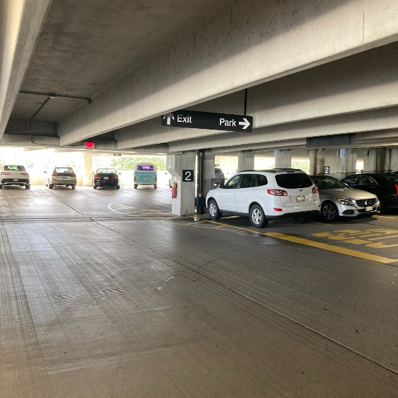 Interior view of the parking garage with 7 parked cars