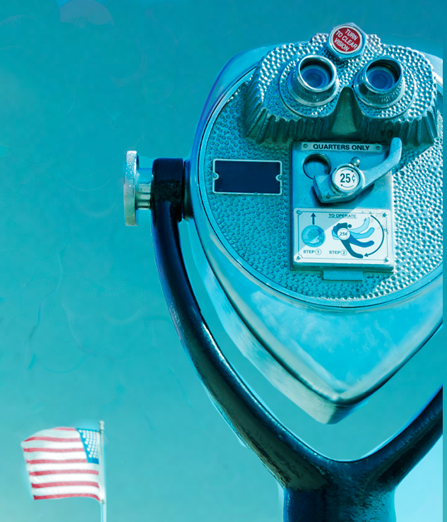 a photo of a coin operated binocular facing a blue sky with an American Flag.