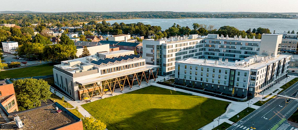 An aerial view that features our McGoldrick Center on the left and our Portland Commons residence hall on the right. Portland's Back Cove appears in the background.