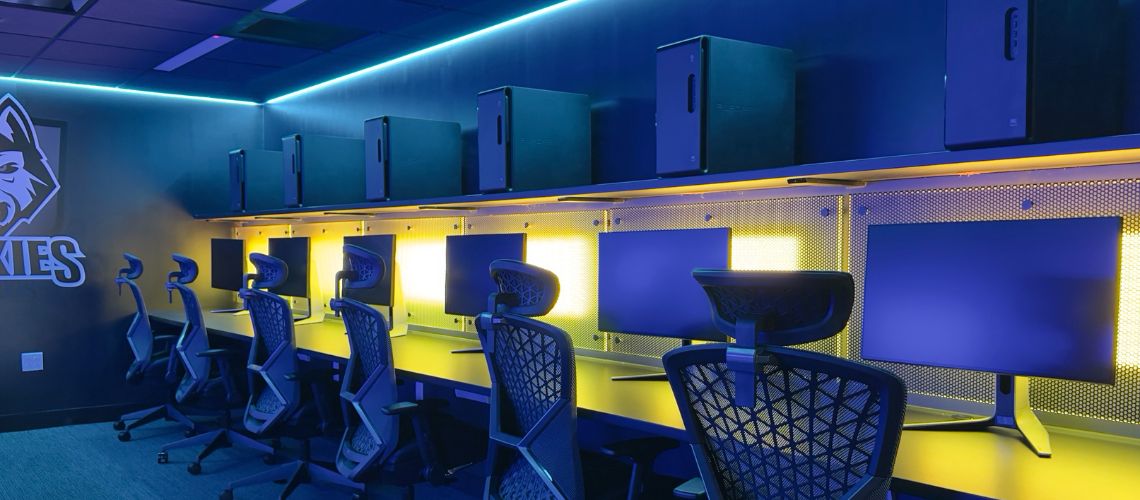 Inside gaming room with computers and chairs