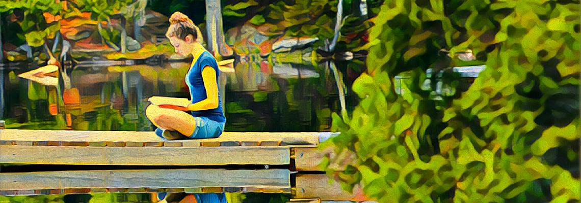 A student reading on a dock. She is surrounded by lush greenery and her reflection is clearly visible. The image has been filtered to look like an oil painting.