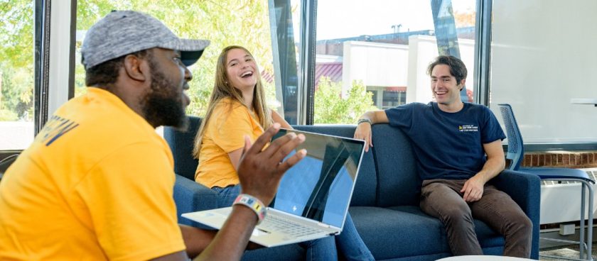 Students laughing and working together