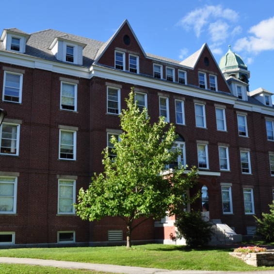 Robie Andrews Hall with tree in summer