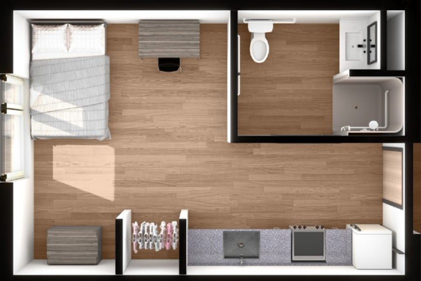 Overhead view of one person efficiency apartment with double bed, kitchenette, and bathroom