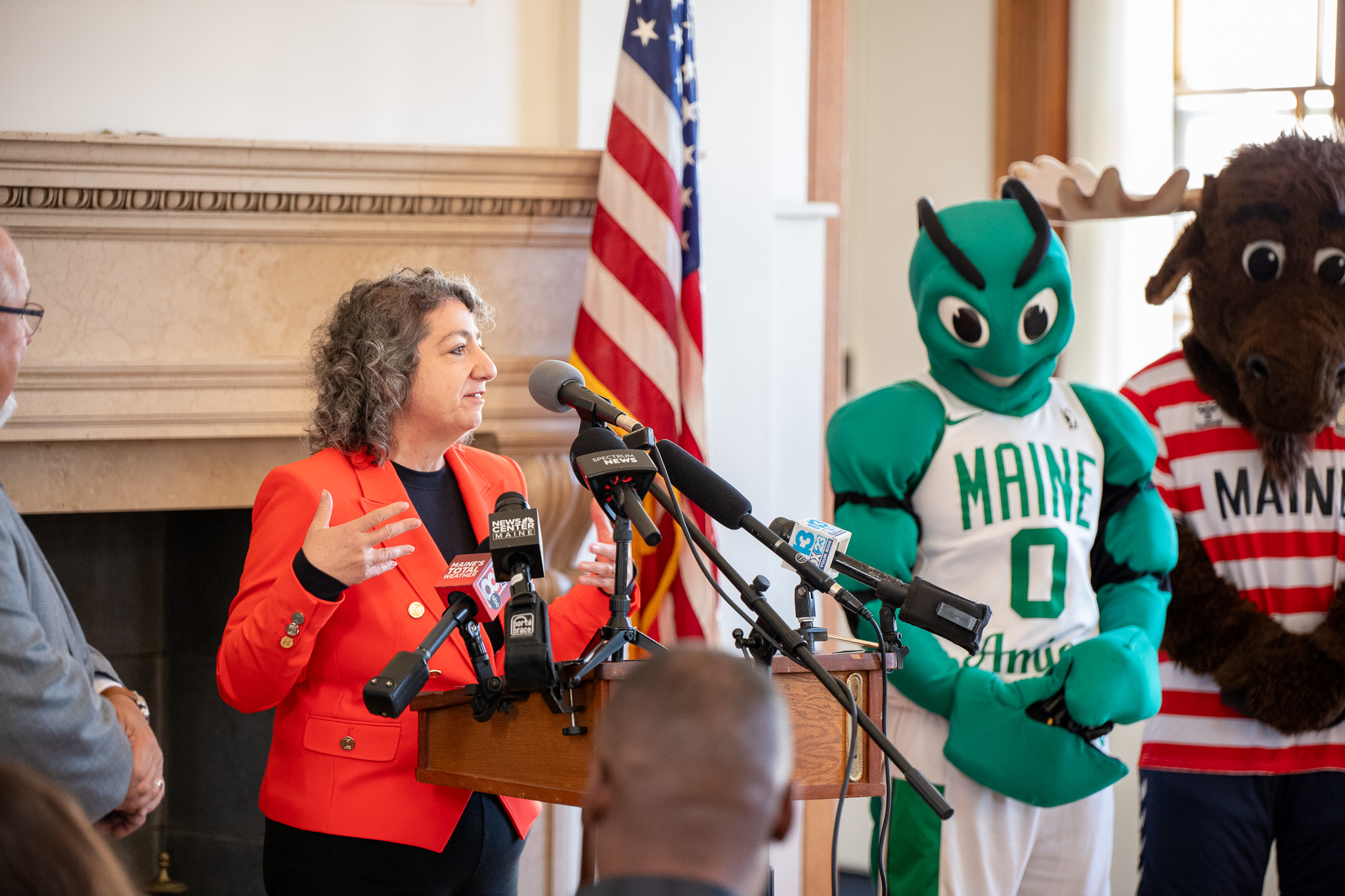 Caroline Paras at Portland City Hall presenting findings from the economic impact report.