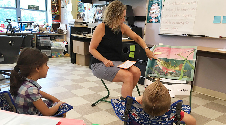 Teacher reading to student