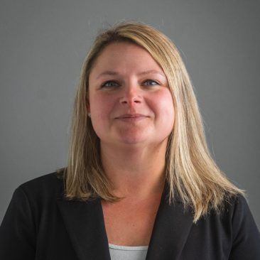 This is a photo of Christina. She has blond hair and is smiling.