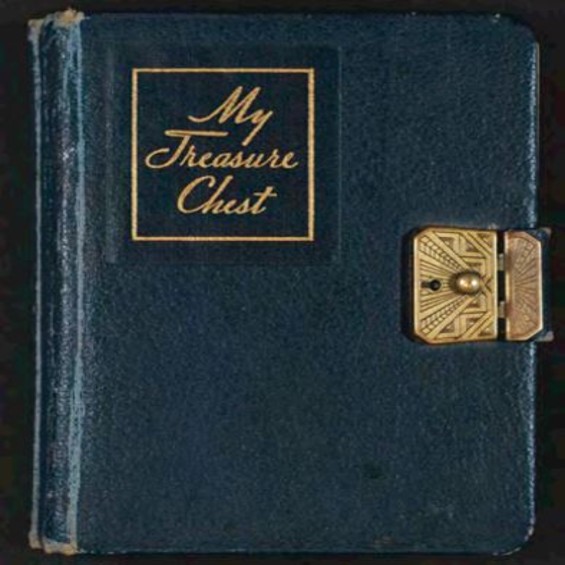 A blue closed book with brass closure