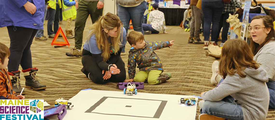 Mission mat on floor, instructing how to program LEGO robots