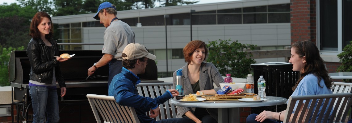 Three USM students at a cookout at the Brooks Student Center on the Gorham campus.