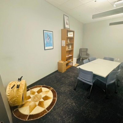 Room with table, bookshelf, and drum
