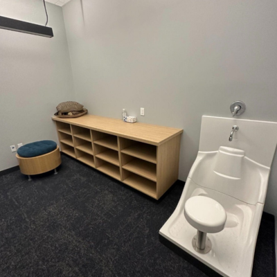Room with prayer washing station and seat