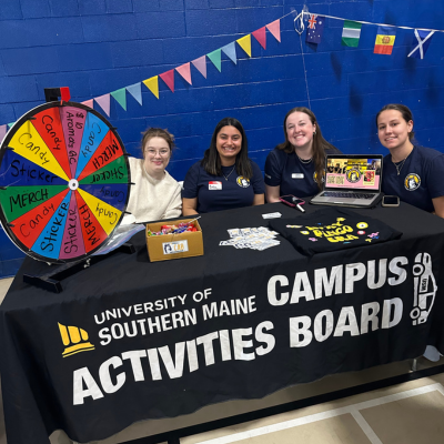Four students tabling for Campus Activities Board