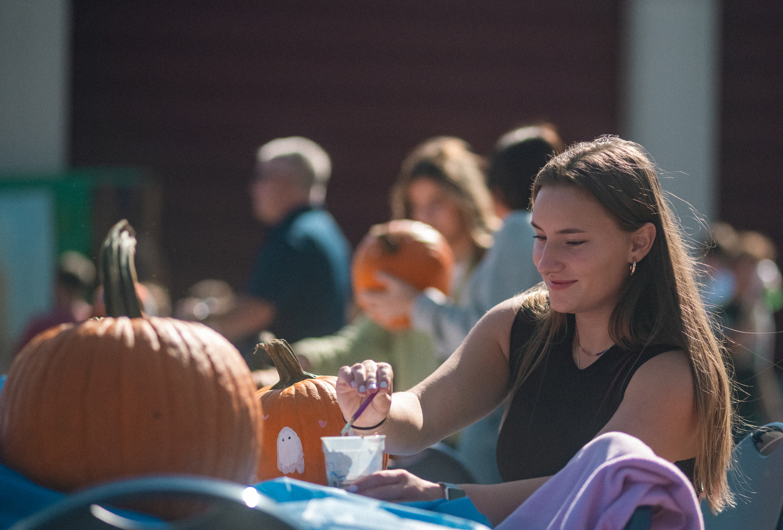 pumpkin painting, part of USM's Homecoming and Family Weekend