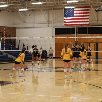 Our Husky Volleyball team standing ready at the net