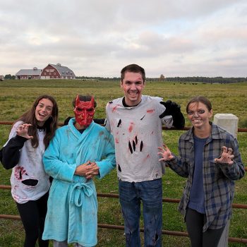 Attendees of the Zombie Run posing in a field.