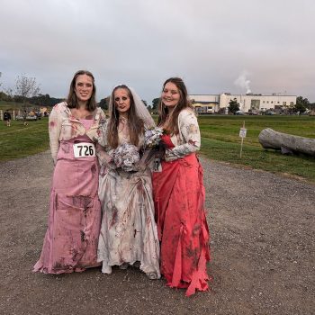 Attendees of the Zombie Run dressed in undead costumes.