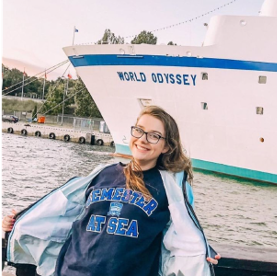 Hannah Daigle in front of a ship