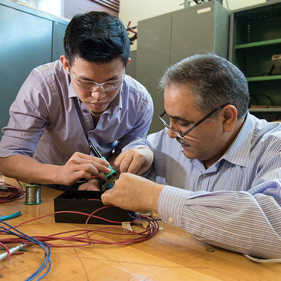 A student and faculty member work together on an electrical project in the John Mitchell Engineering and Technology center.