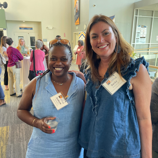 Becky McKinnell posing for a photo with Jocelyne Kamikazi