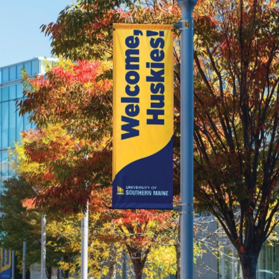 Photo of Welcome Huskies banner hanging off outdoor pole