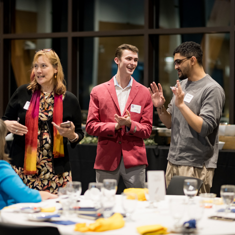 Students talking at an event