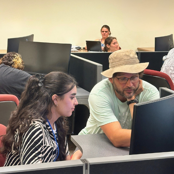 UB student and advisor work on college essay writing.