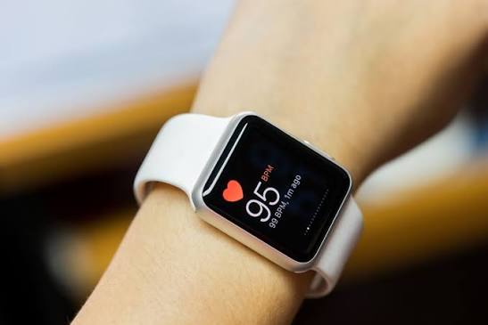 A biometric watch is shown on a wrist. Heart rate is 95.