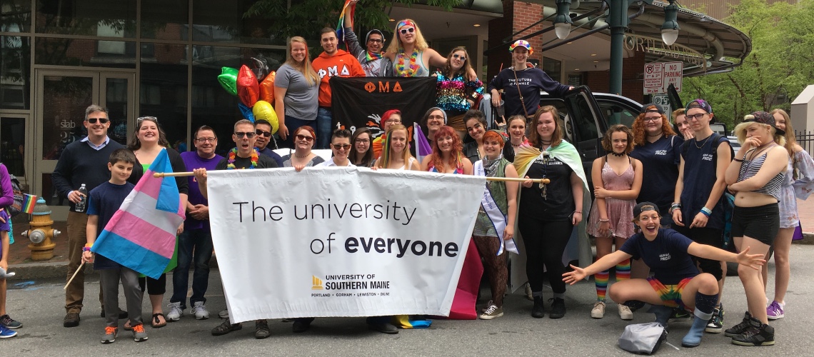 The University of Everyone sign at a Pride Event 