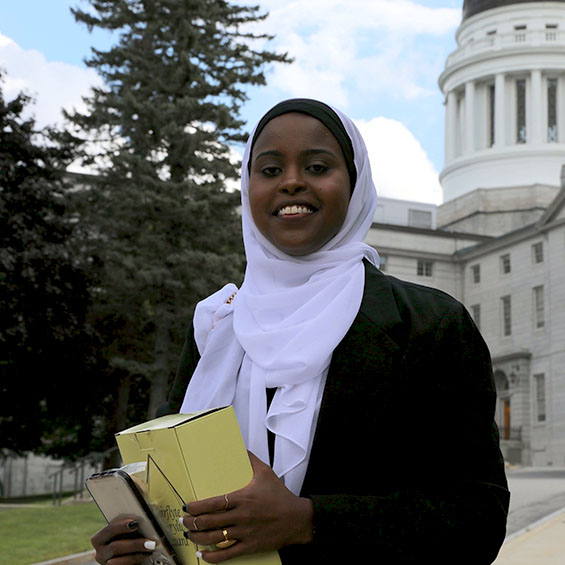 Marwo Sougue poses outside a government building in Washington D.C.