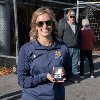 Peyton Dostie Collins displays the ring she received as a new member of the LEC Hall of Fame.